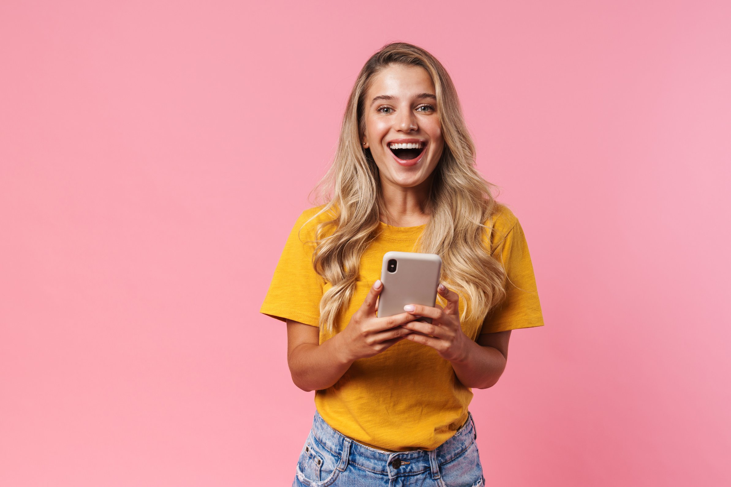 Positive Young Woman Using Mobile Phone